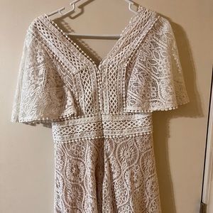 Lulus white/cream colored dress. Lace detailing. Size medium and worn once!